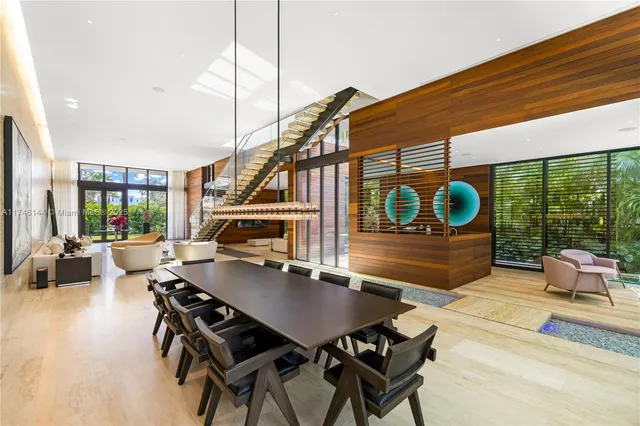 a bedroom with a large bed and a large window