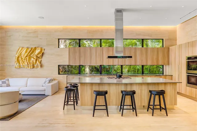 a bedroom with two beds and a large window