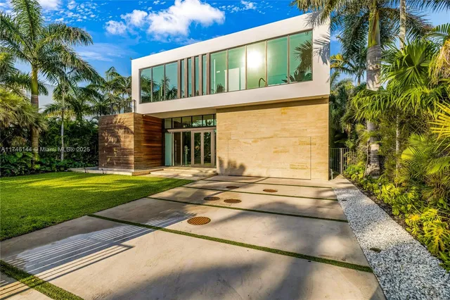 a lobby with furniture and floor to ceiling window