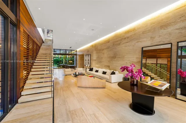 a living room with couch and a large window