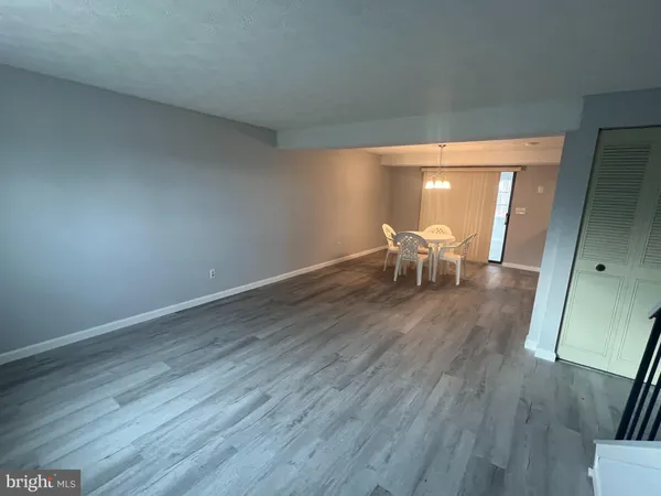 a workspace room with furniture and window