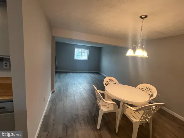 a view of a small space with wooden floor