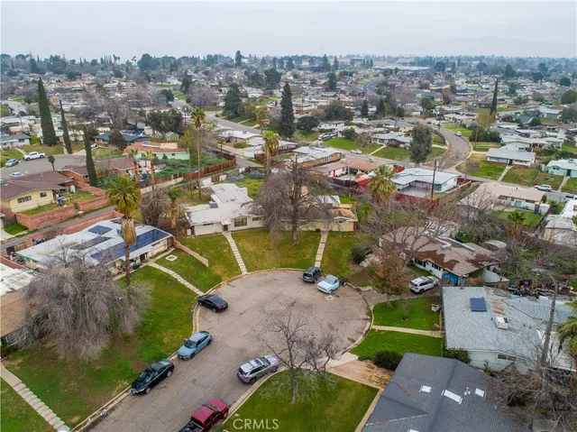 an aerial view of a house with a yard