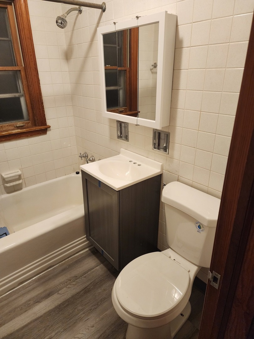 3830 217th Street Matteson, IL 60443 - Photo 5 of 6 a bathroom with a sink toilet and shower