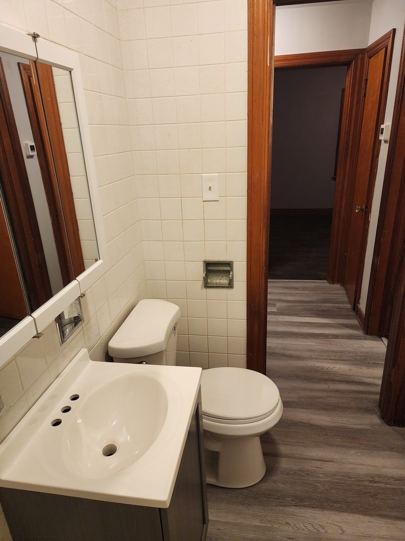 3830 217th Street Matteson, IL 60443 - Photo 6 of 6 a bathroom with a sink a toilet and shower