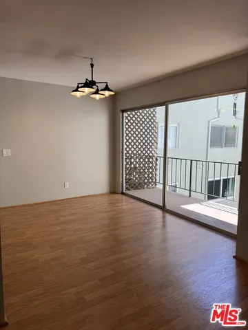 a view of a livingroom with wooden floor