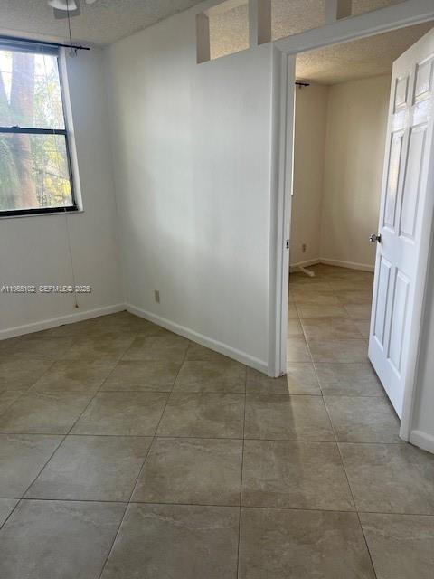2401 Riverside Drive, Unit 110B Coral Springs, FL 33065 - Photo 11 of 27 a view of an empty room with a window