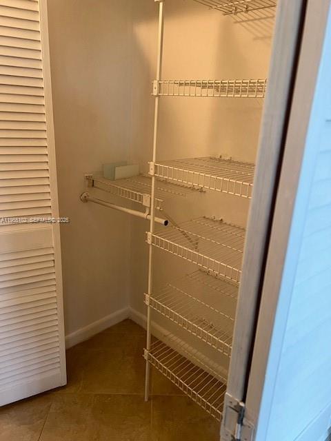 2401 Riverside Drive, Unit 110B Coral Springs, FL 33065 - Photo 13 of 27 a bathroom with a glass door shower and closet