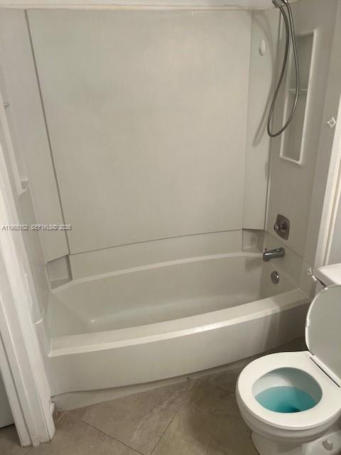 2401 Riverside Drive, Unit 110B Coral Springs, FL 33065 - Photo 17 of 27 a white toilet and tub sitting next to a bath tub