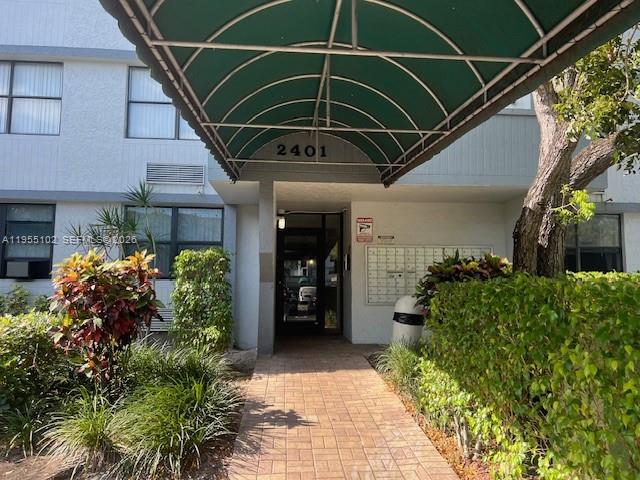 2401 Riverside Drive, Unit 110B Coral Springs, FL 33065 - Photo 2 of 27 a view of a entryway of the house