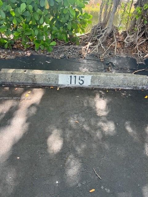 2401 Riverside Drive, Unit 110B Coral Springs, FL 33065 - Photo 22 of 27 a view of a tree in a yard