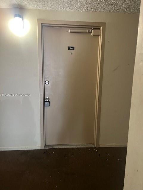 2401 Riverside Drive, Unit 110B Coral Springs, FL 33065 - Photo 25 of 27 an empty room with closet area