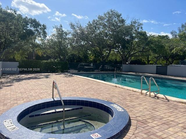 2401 Riverside Drive, Unit 110B Coral Springs, FL 33065 - Photo 27 of 27 a view of swimming pool with a yard