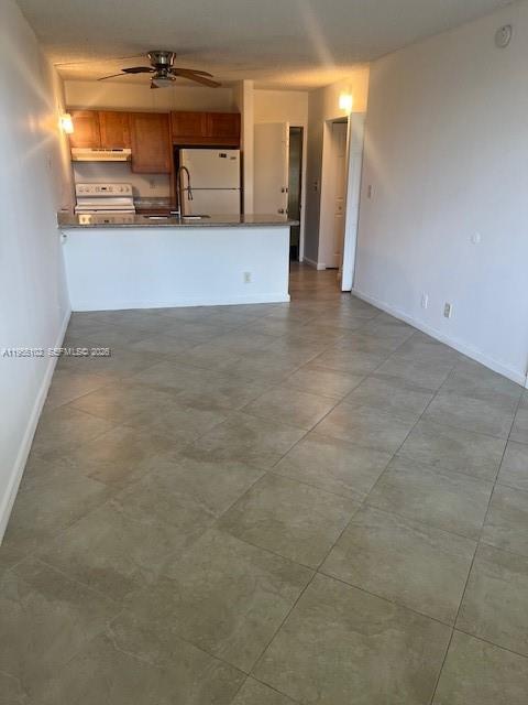 2401 Riverside Drive, Unit 110B Coral Springs, FL 33065 - Photo 4 of 27 a view of a refrigerator and a sink