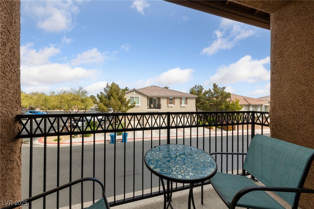 9121 Ripple Ridge Avenue, Unit 101 Las Vegas, NV 89149 - Photo 1 of 16 Balcony featuring a residential view