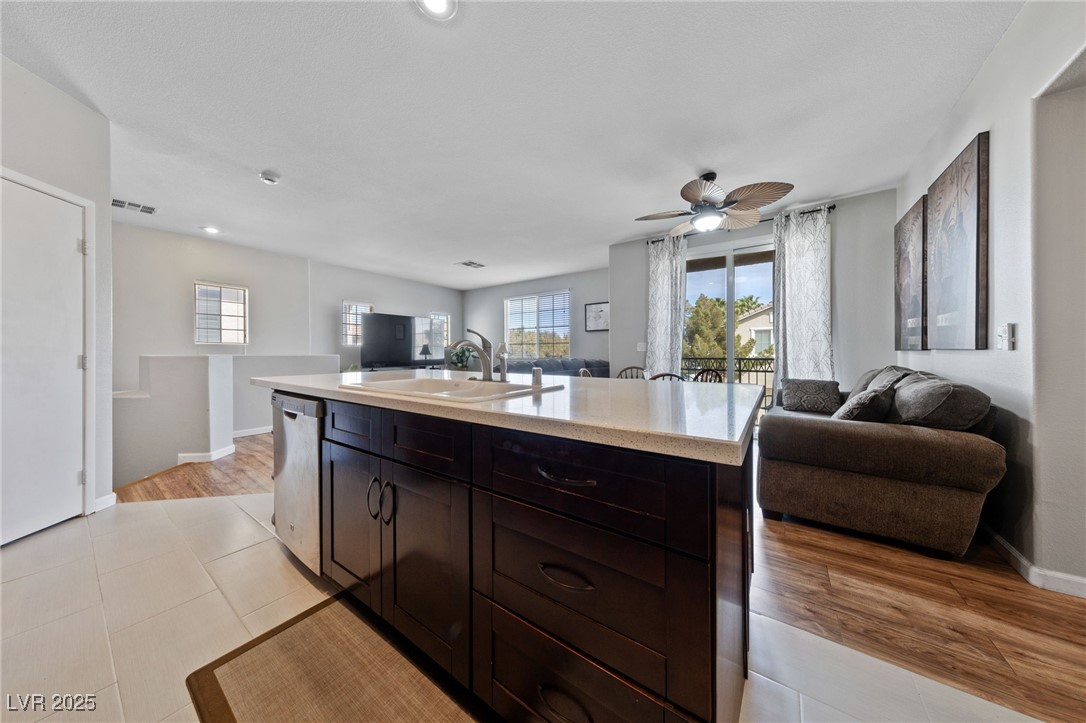 9121 Ripple Ridge Avenue, Unit 101 Las Vegas, NV 89149 - Photo 16 of 16 Kitchen featuring open floor plan, light countertops, dishwasher, a ceiling fan, and recessed lighting