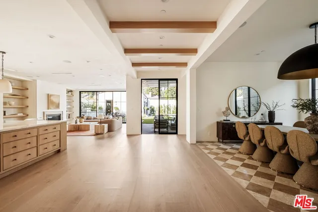 a living room with furniture large window and flat screen tv