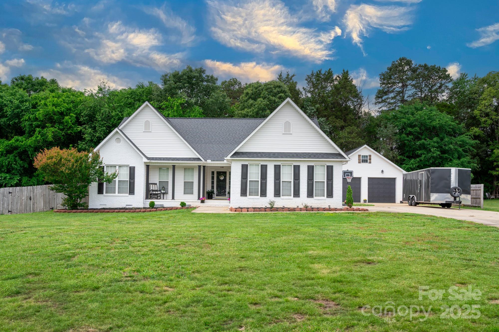 1140 Landsdown Drive Salisbury, NC 28147 - Photo 1 of 37 a view of a house with a big yard and large trees