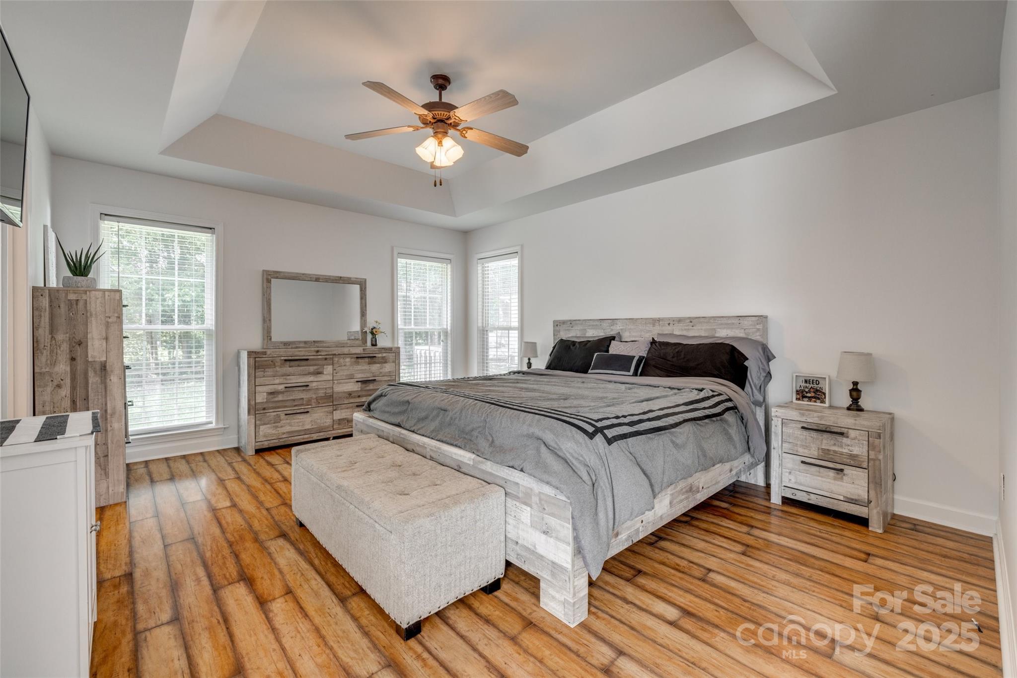 1140 Landsdown Drive Salisbury, NC 28147 - Photo 19 of 37 a spacious bedroom with a bed and a chandelier