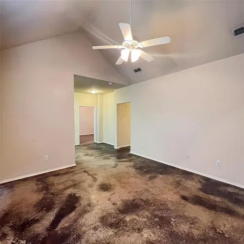 a kitchen with stainless steel appliances a stove refrigerator and microwave