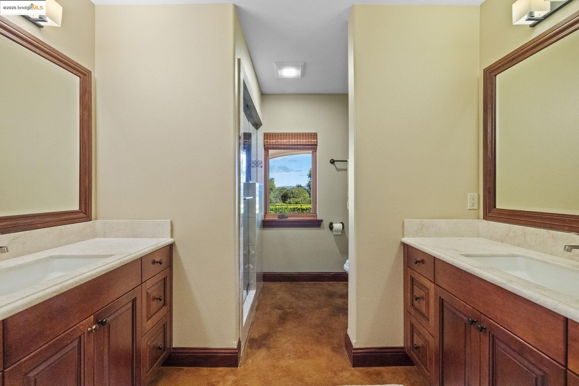 10270 Slate Rim Road Sonora, CA 95370 - Photo 30 of 55 a bathroom with a sink and a mirror