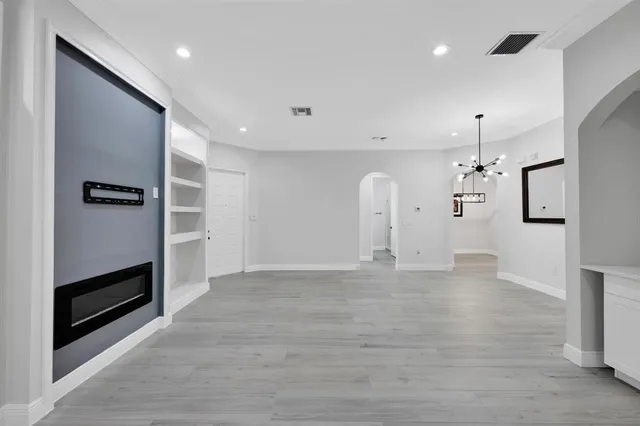 a view of a kitchen with a sink and a stove top oven