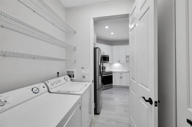 a room with a white cabinet and a sink
