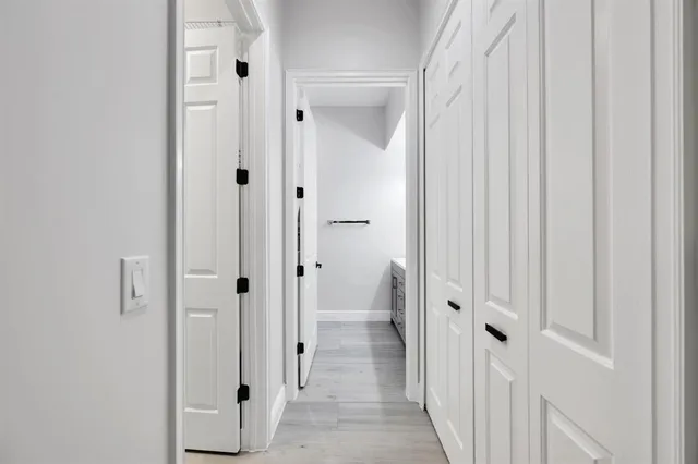 a view of a bathroom from the hallway