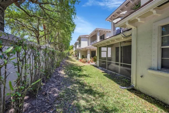 a backyard of a house with lots of green space