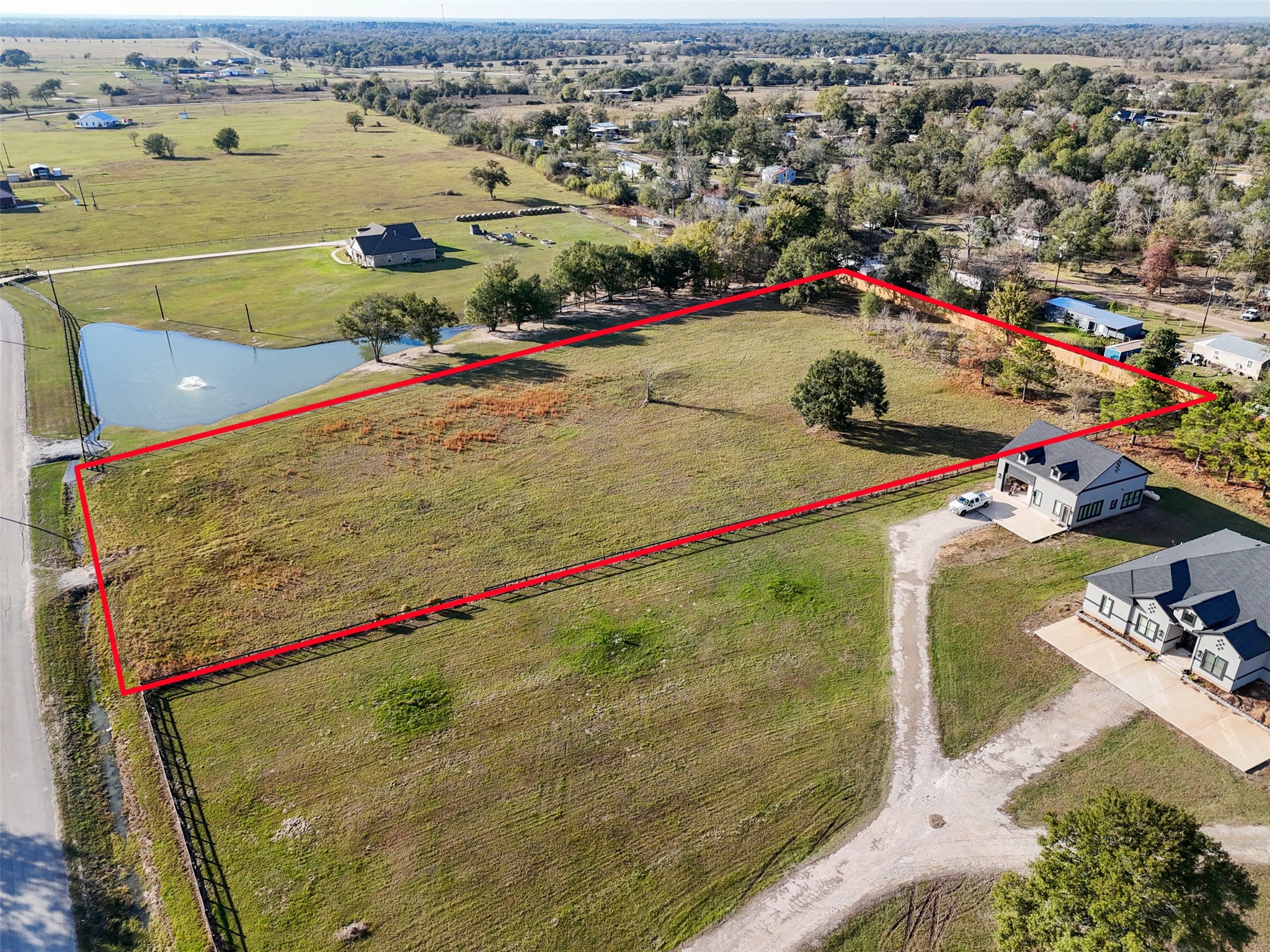 23300 Legacy Lane Hempstead, TX 77445 - Photo 6 of 10 a view of a tennis ground with a large pool