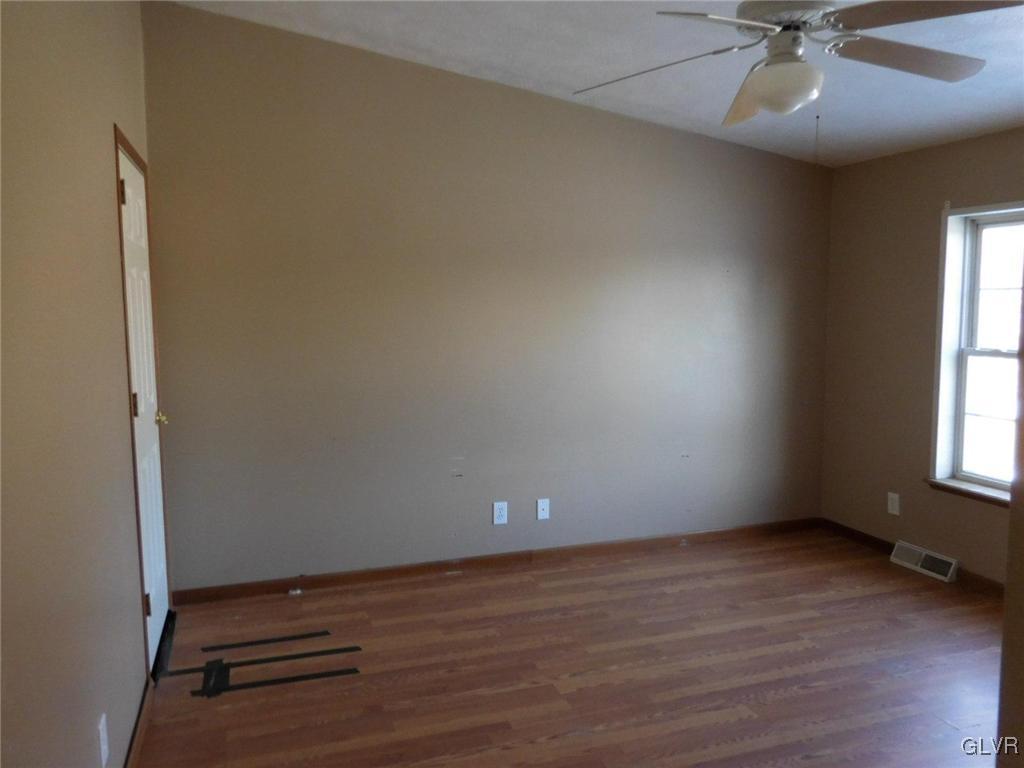 698 Point Phillips Road Bath, PA 18014 - Photo 8 of 10 wooden floor and window in an empty room