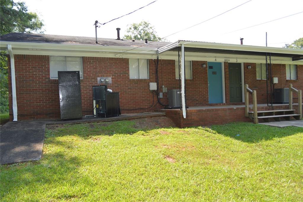 8859 Main Street, Unit 2 Woodstock, GA 30188 - Photo 12 of 12 a view of a house with yard