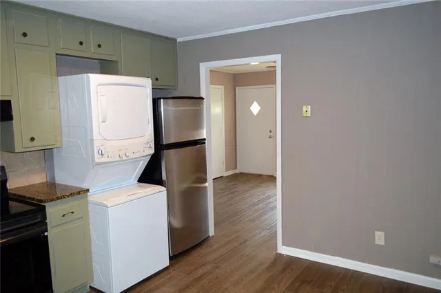a view of kitchen with wooden floor