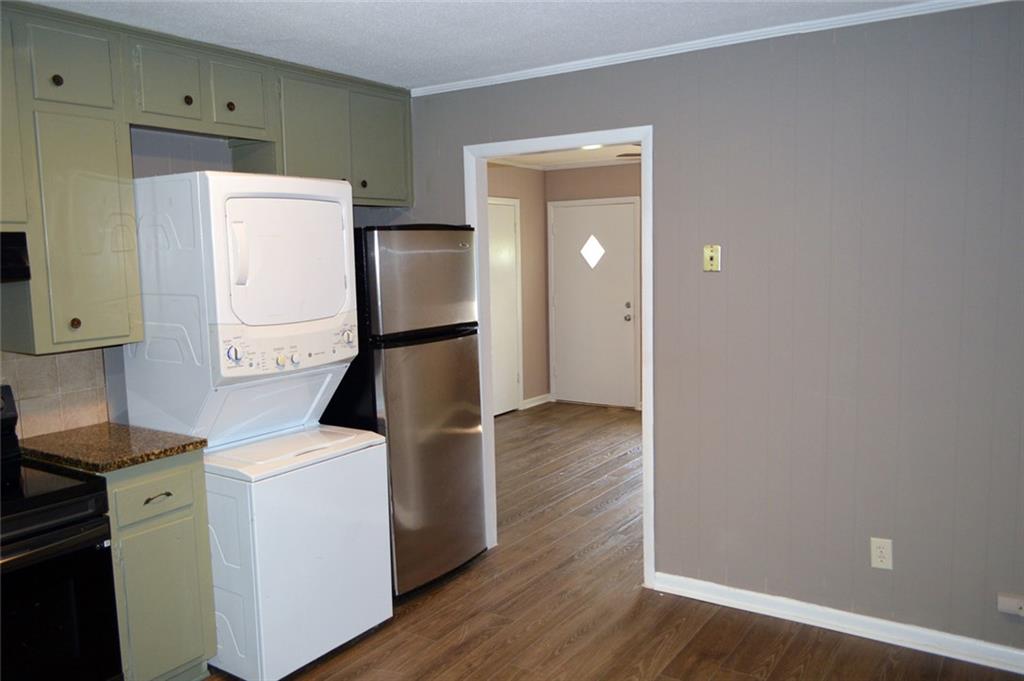 8859 Main Street, Unit 2 Woodstock, GA 30188 - Photo 5 of 12 a view of kitchen with wooden floor