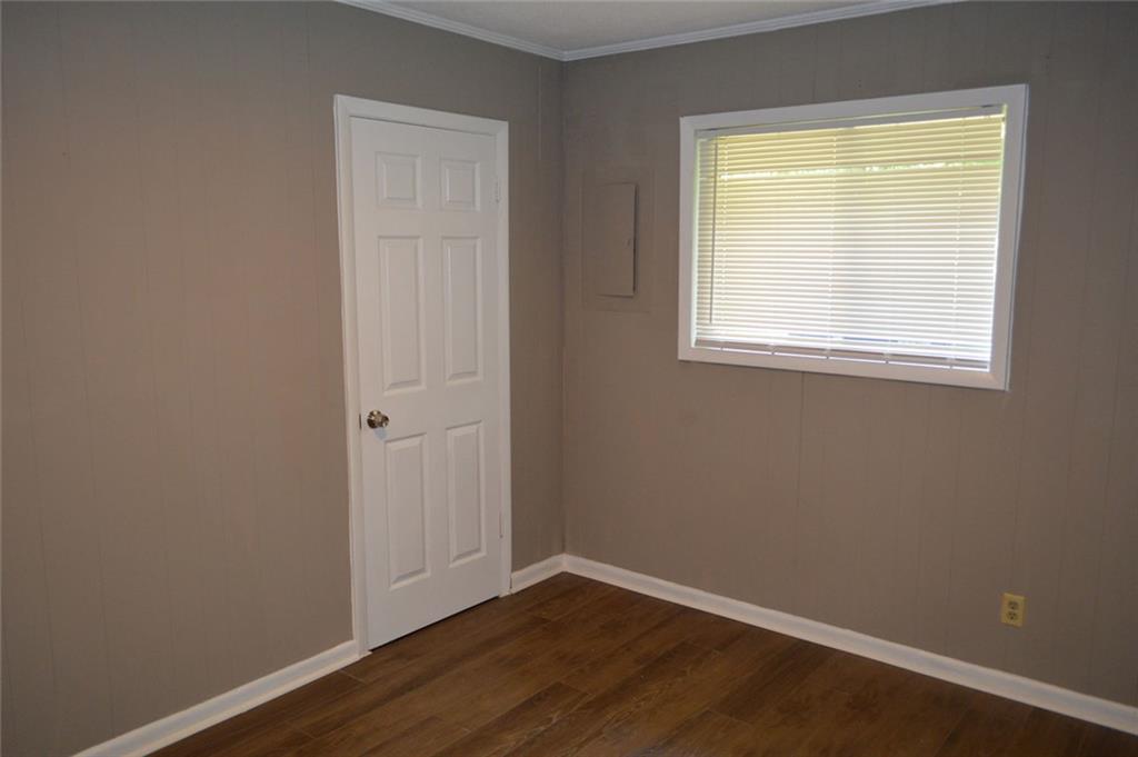 8859 Main Street, Unit 2 Woodstock, GA 30188 - Photo 7 of 12 an empty room with a window