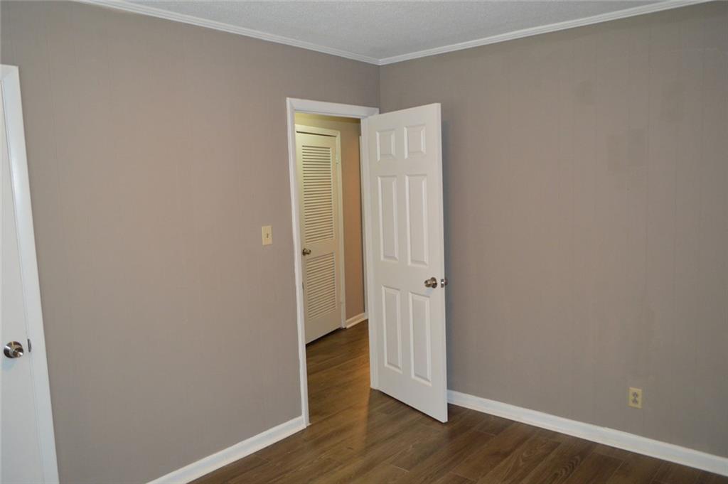 8859 Main Street, Unit 2 Woodstock, GA 30188 - Photo 10 of 12 a view of a room with wooden floor