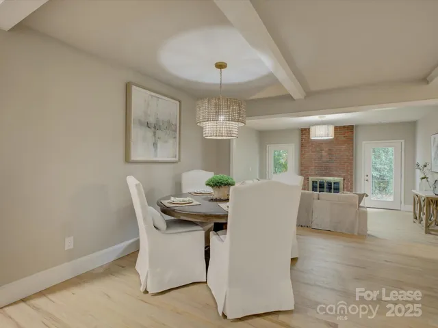 a dining room with furniture and window