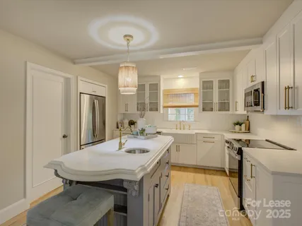 a view of a kitchen area with furniture and window