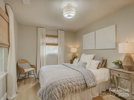 a bedroom with a bed and chair