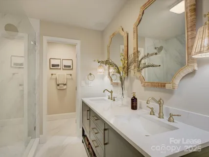 a bathroom with a sink double vanity and a mirror