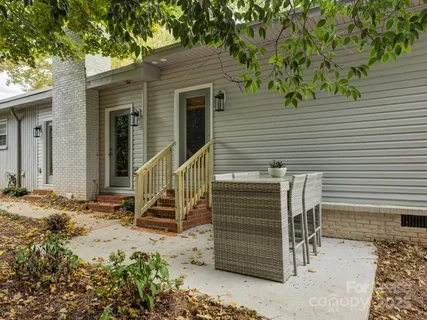 a front view of a house with stairs