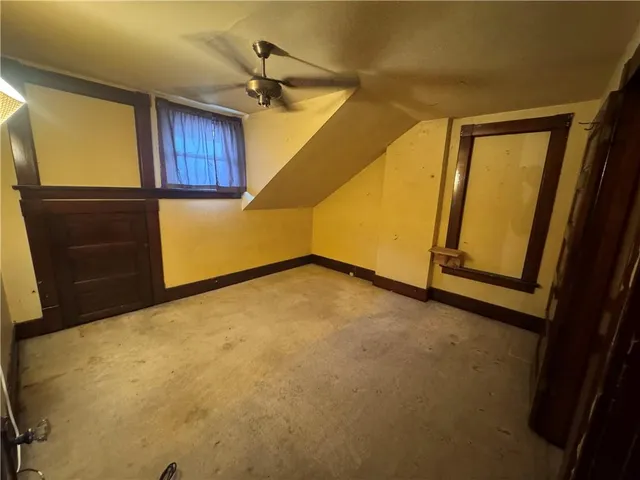 a view of a room with wooden walls