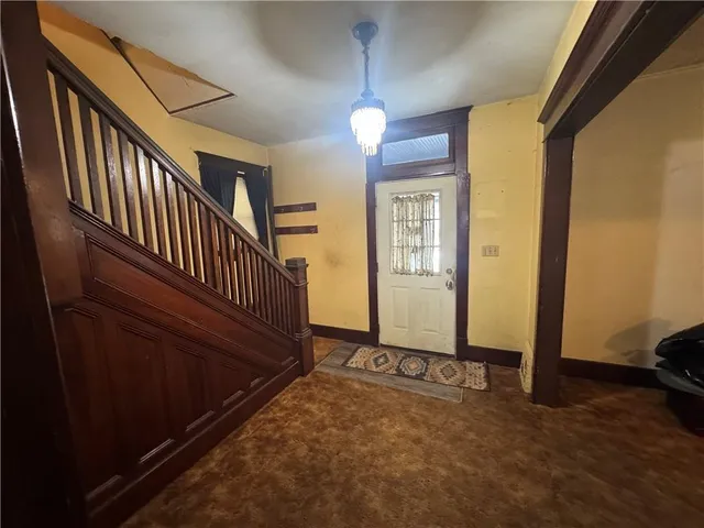 a view of a hallway with windows