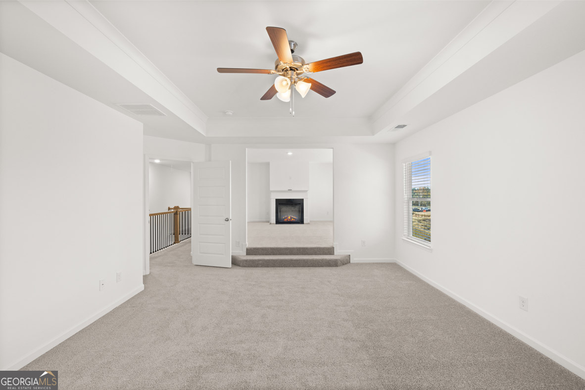 408 Hazel Drive Locust Grove, GA 30248 - Photo 16 of 32 a view of a livingroom with a ceiling fan and window