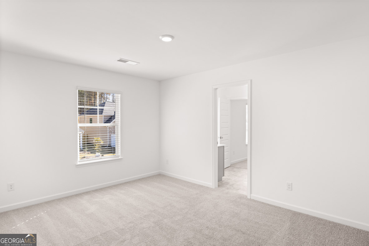 408 Hazel Drive Locust Grove, GA 30248 - Photo 22 of 32 a view of an empty room with a window