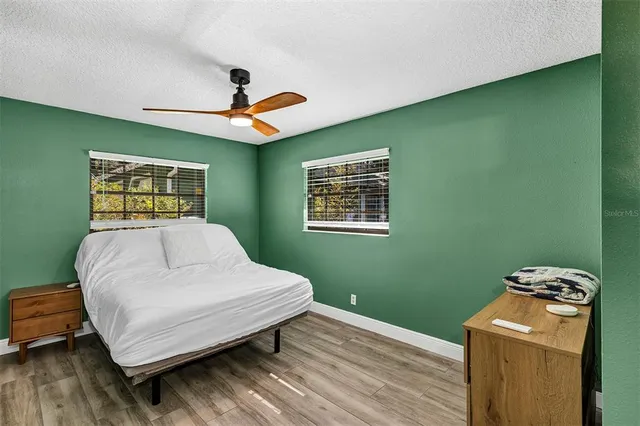 a view of a hallway to a livingroom with furniture