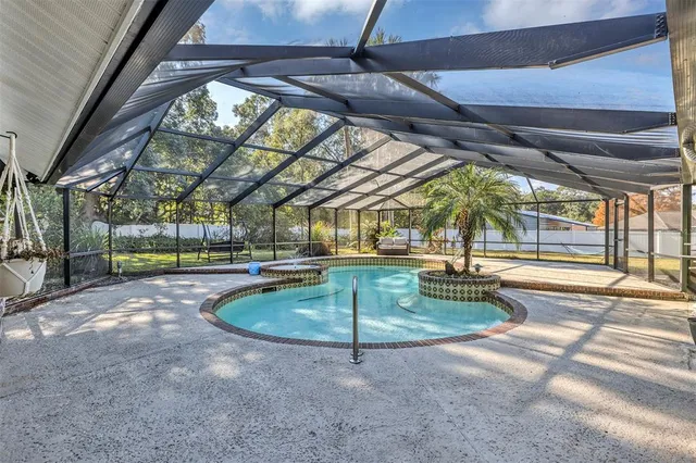 a kitchen with stainless steel appliances a refrigerator sink and microwave