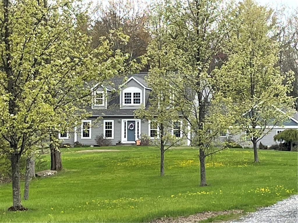 51 Pedersen Road Hartland, CT 06027 - Photo 1 of 1 a front view of a house with a garden