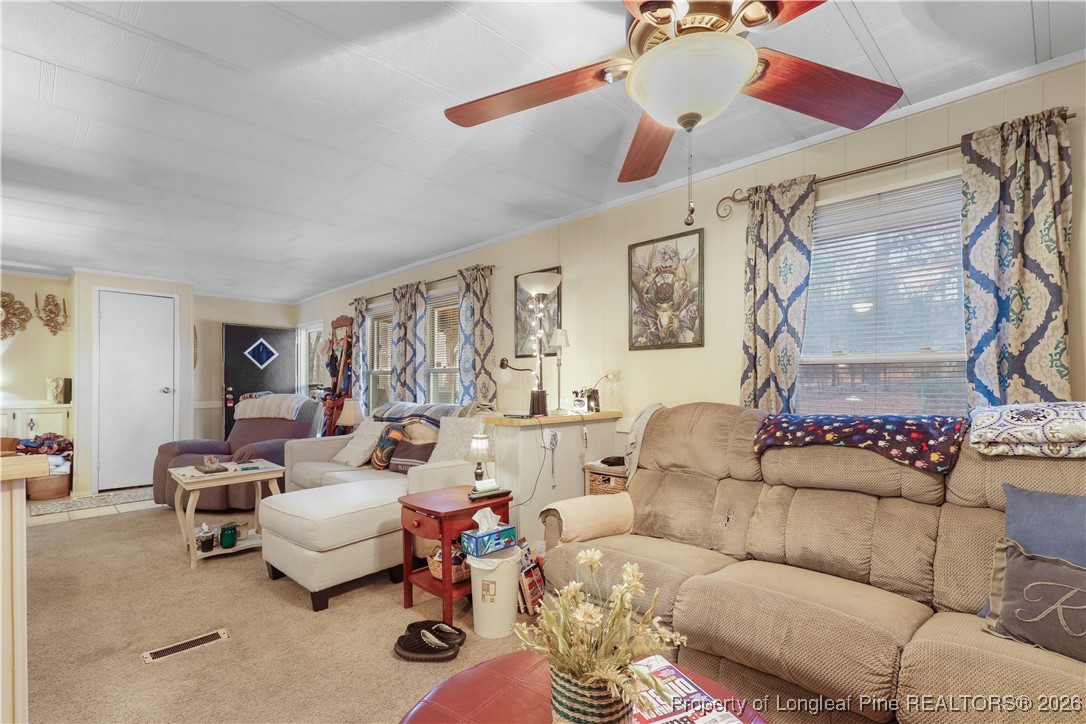 156 Connell Road Carthage, NC 28327 - Photo 11 of 43 a living room with furniture and a large window