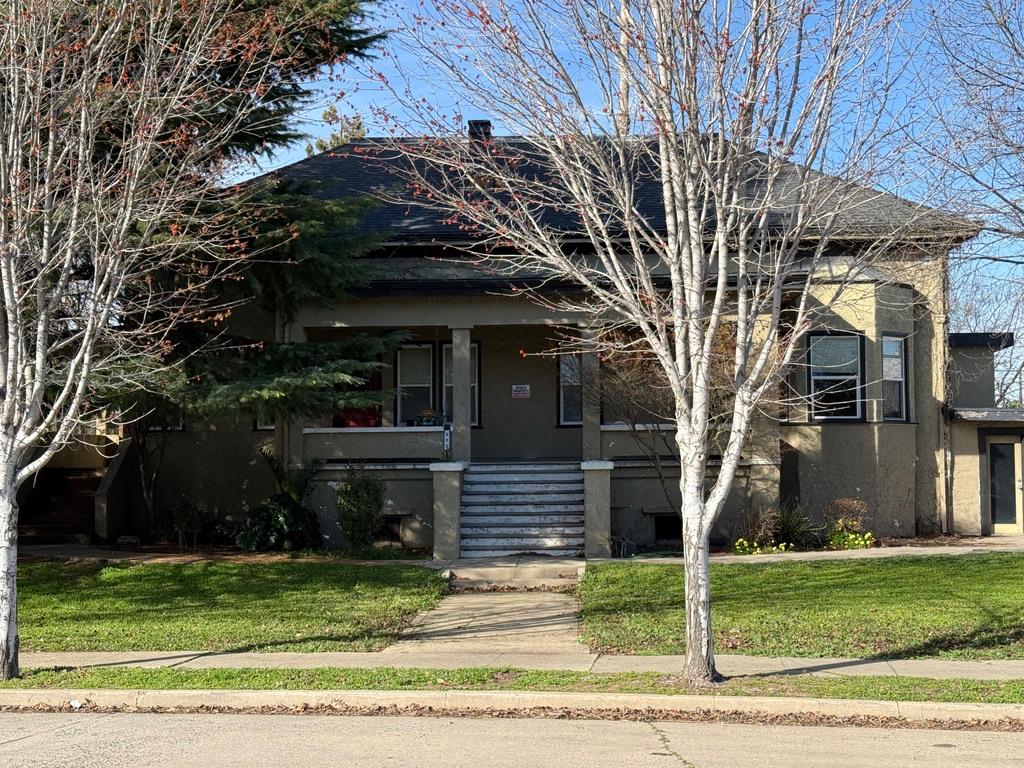 a front view of a house with a yard